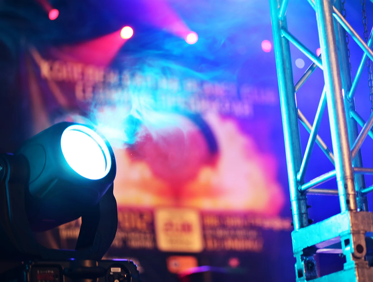 stage lights mounted to scaffolding and on floor